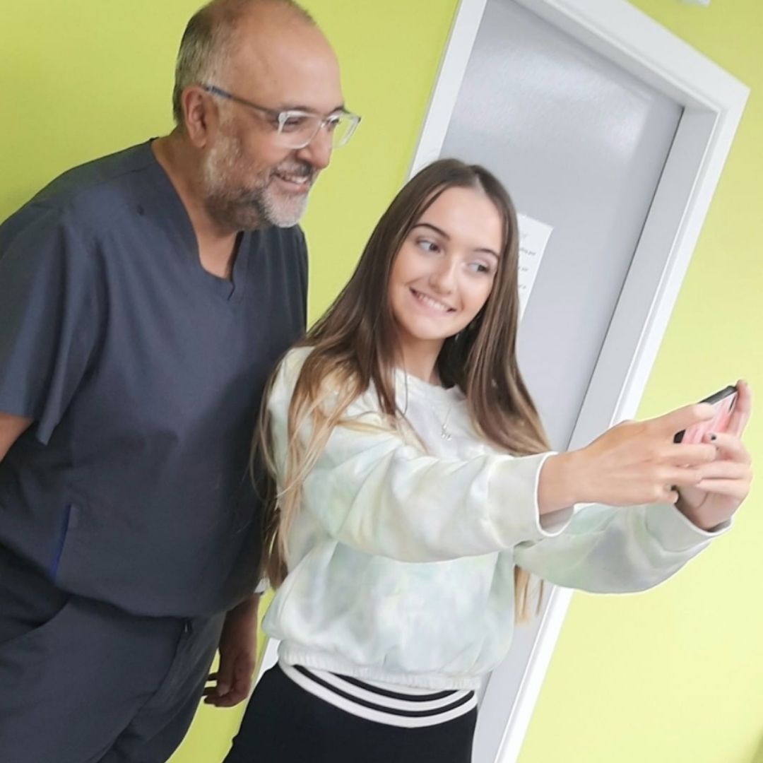 Ennis and Limerick Braces Orthodontist Jeeves and Customer Showing Off Straight White Teeth Selfie
