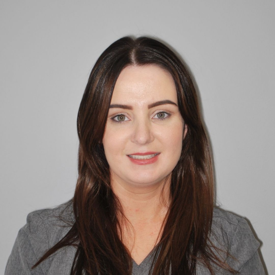 ennis orthodontics team Receptionist - Tara Griffin Ennis Braces Orthodontist Team Photo with Jeeves in Grey Chair